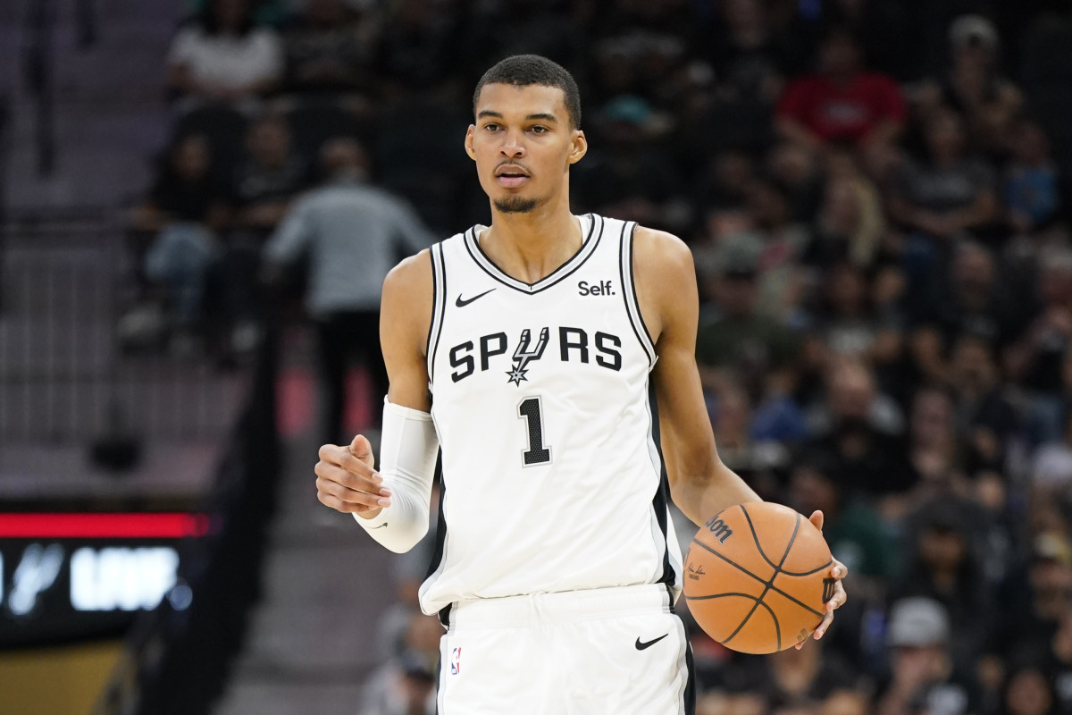Oct 13, 2023; San Antonio, Texas, USA; San Antonio Spurs center Victor Wembanyama (1) dribbles the ball up court during the first half against the Miami Heat at Frost Bank Center.